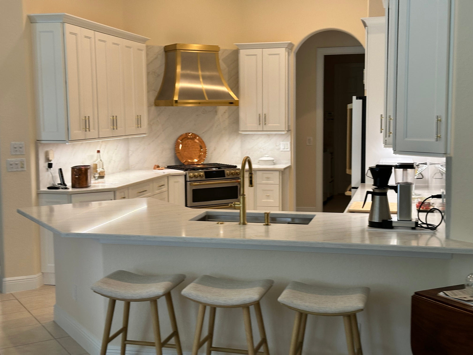 Why Brass Looks So Good on a Brushed Stainless Steel Kitchen Hood